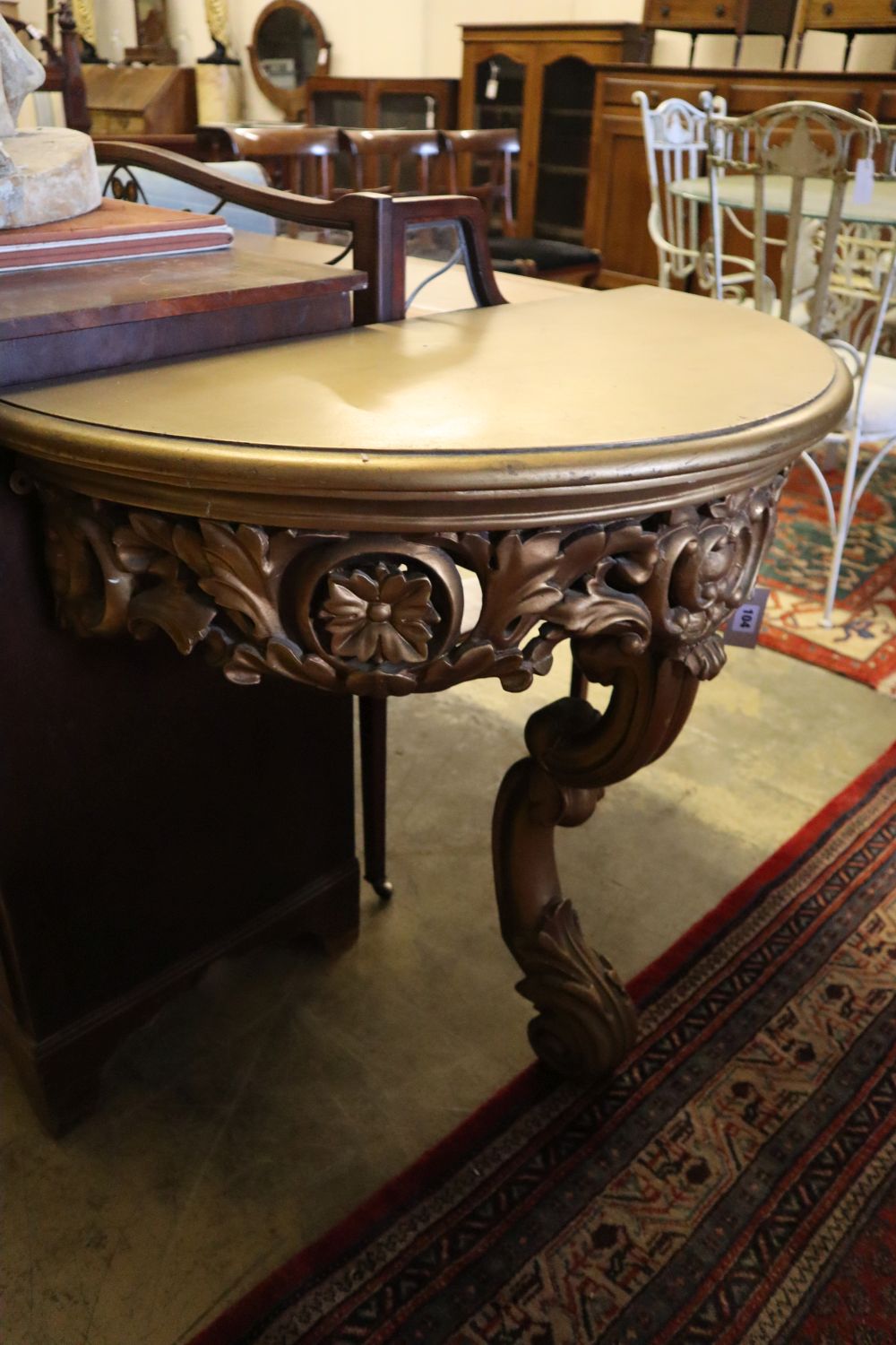 An 18th century design gilt D shaped console table, width 86cm, depth 42cm, height 75cm